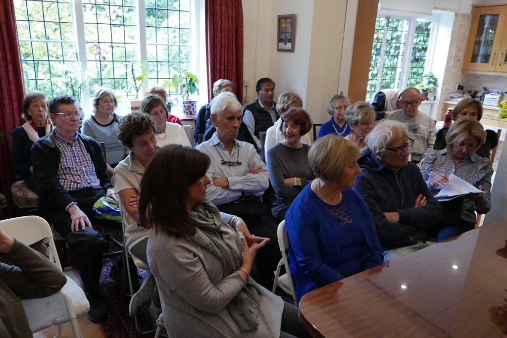 Packed room listening to former ambassador