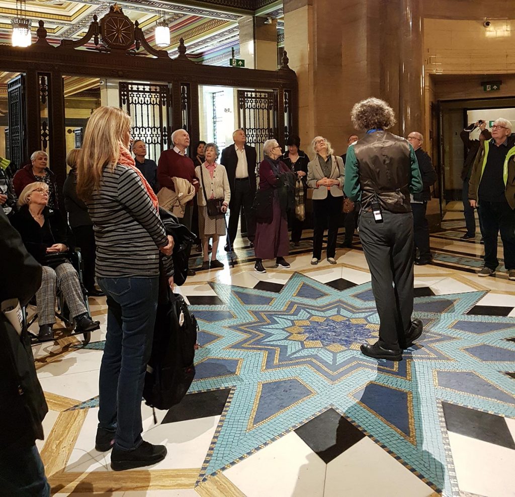 Group of people listening to guide