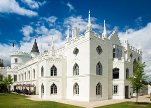 External view of Strawberry Hill house, a large white building with a tower.