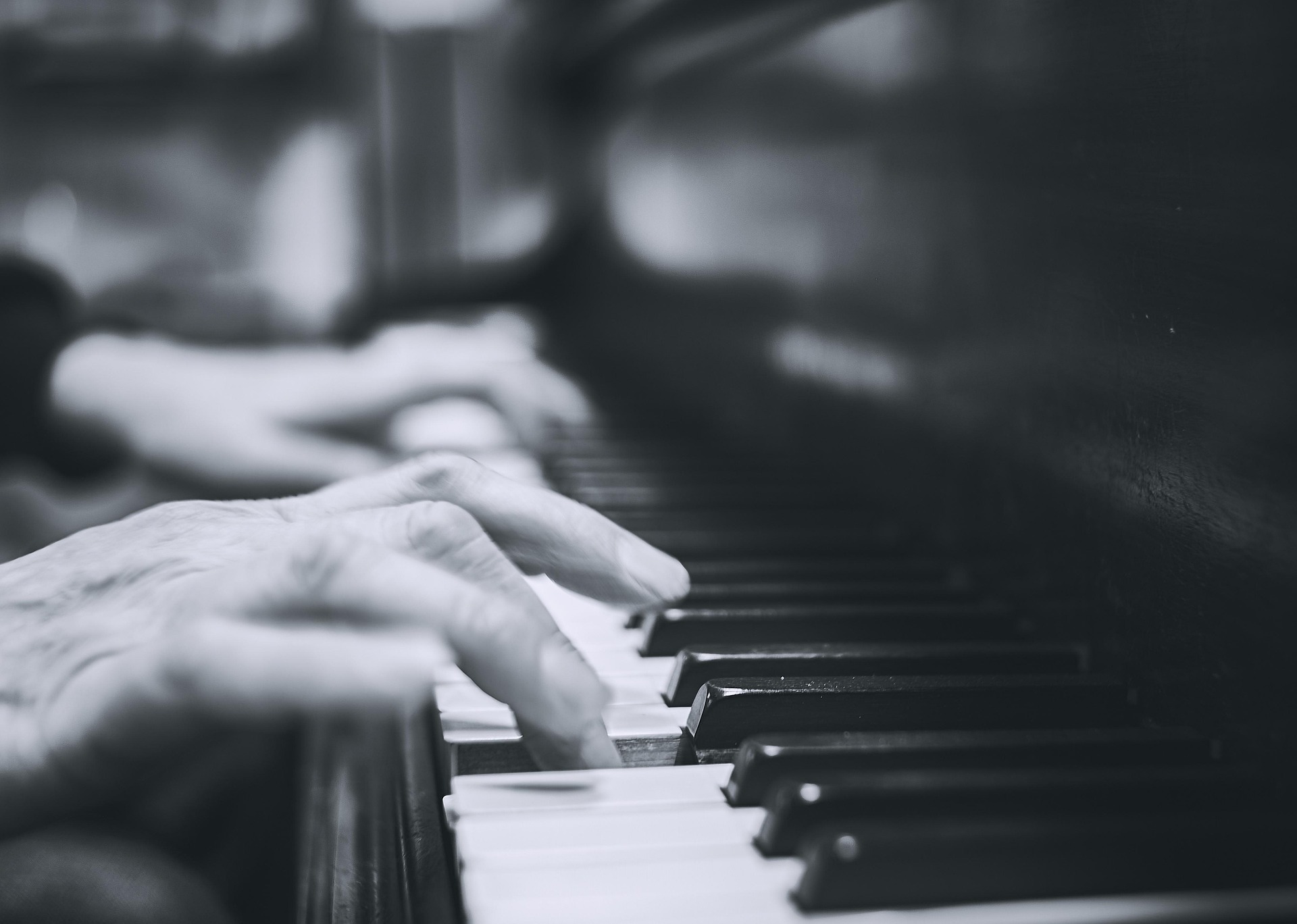 Hands on piano keyboard