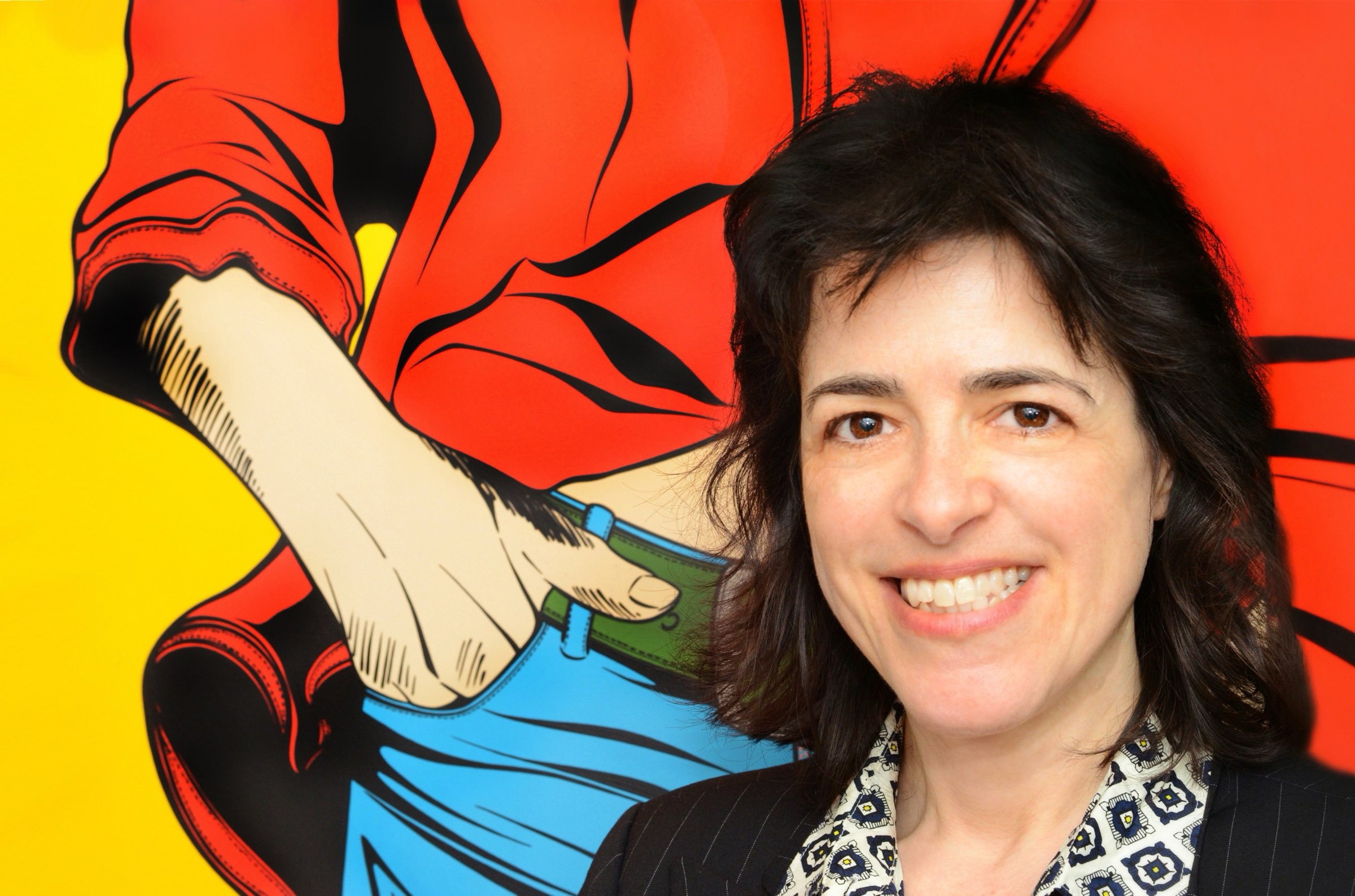 Woman with long black hair standing in front of painting of person with blue trousers and red shirt